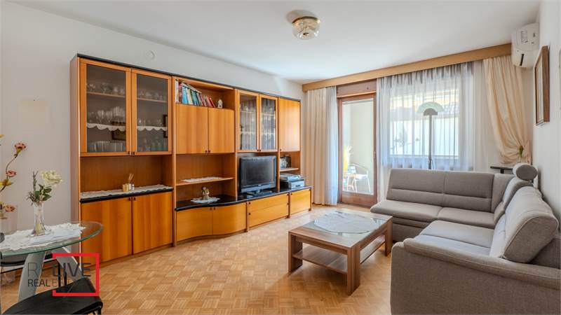 Trilocale con grande terrazza coperta in zona residenziale tranquilla